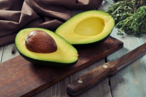 fresh-avocado-cutting-board-over-wooden-background